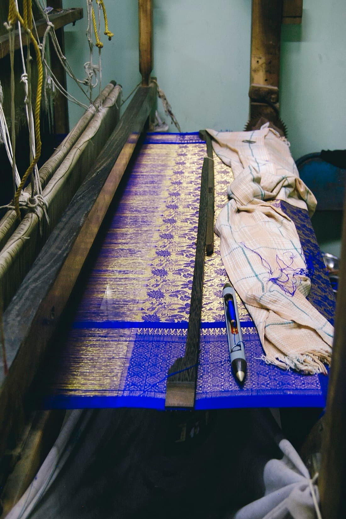 Royal blue and gold Kanjivaram silk on a wooden handloom